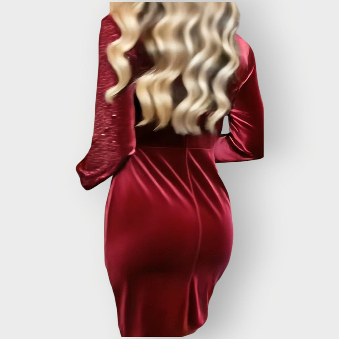 Flat-lay styling of the Abbie asymmetrical party dress in red, showing color and fabric texture