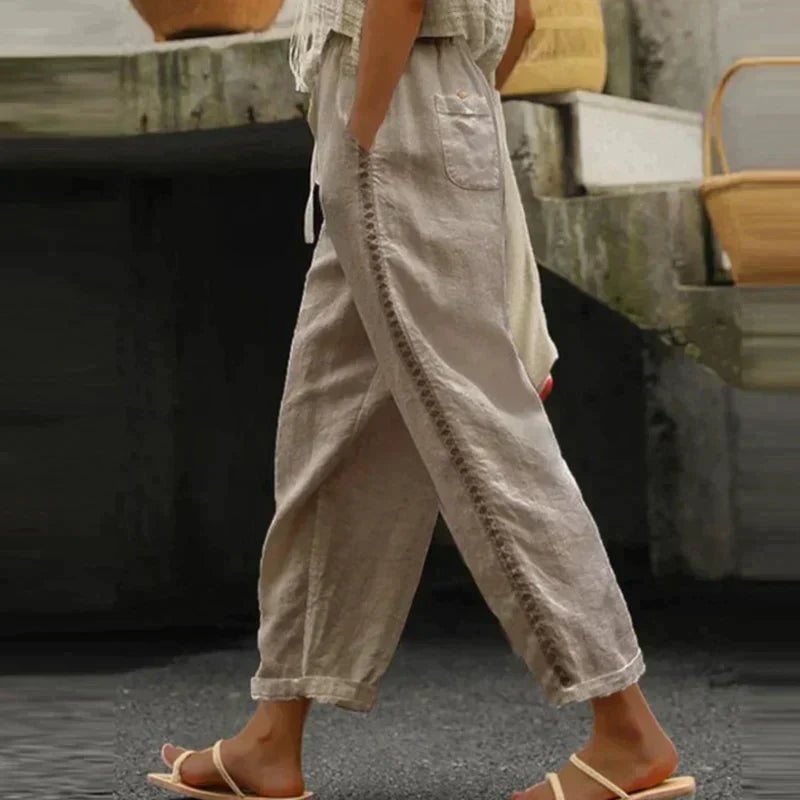 Women's gray Abby high-waist tapered trousers with side stripe, styled with a tucked-in top