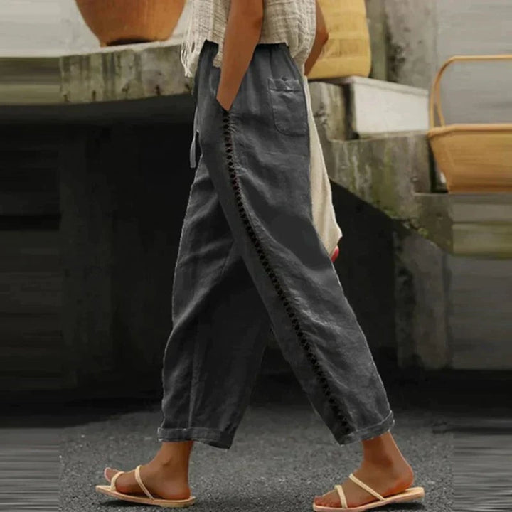 Back view of Abby tapered trousers in khaki showing high-rise waistband and tapered ankle