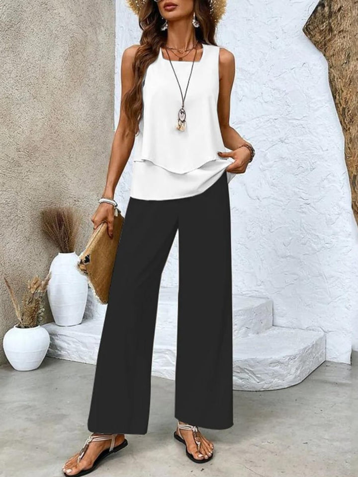 Front view of the flowy wide-leg pants and layered sleeveless blouse two-piece set in black