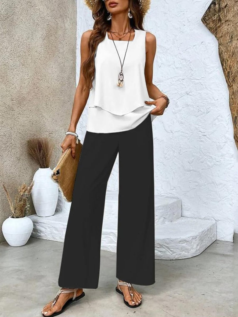 Front view of the flowy wide-leg pants and layered sleeveless blouse two-piece set in black