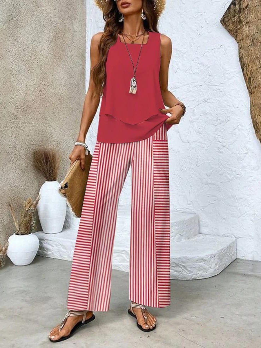 Close-up of the delicate leaf-patterned wide-leg pants with elastic waistband detail in beige