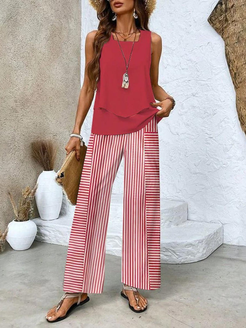 Close-up of the delicate leaf-patterned wide-leg pants with elastic waistband detail in beige
