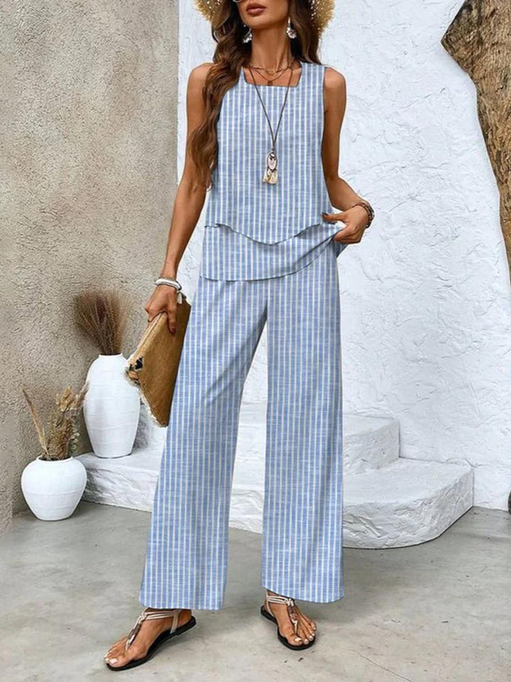 Model styling the two-piece set with heeled sandals for an elevated evening look in red