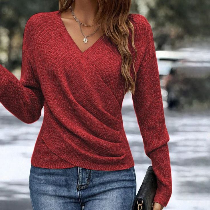 Model posing in the Abigail sweater, showcasing its smooth drape and versatile styling options