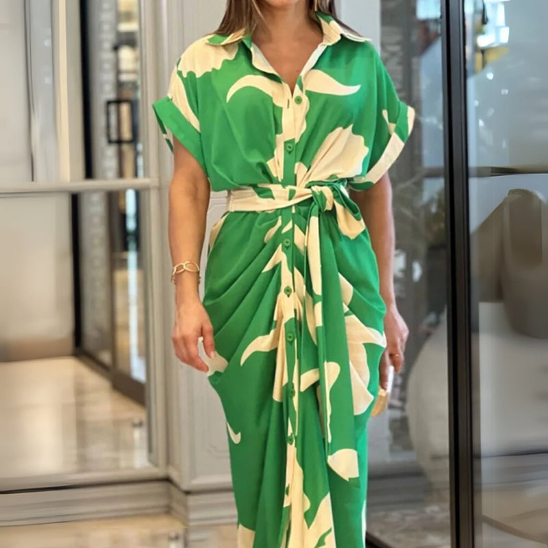 Woman wearing a flowing wrap dress with an adjustable waist belt in a vibrant color, showcasing a flattering silhouette