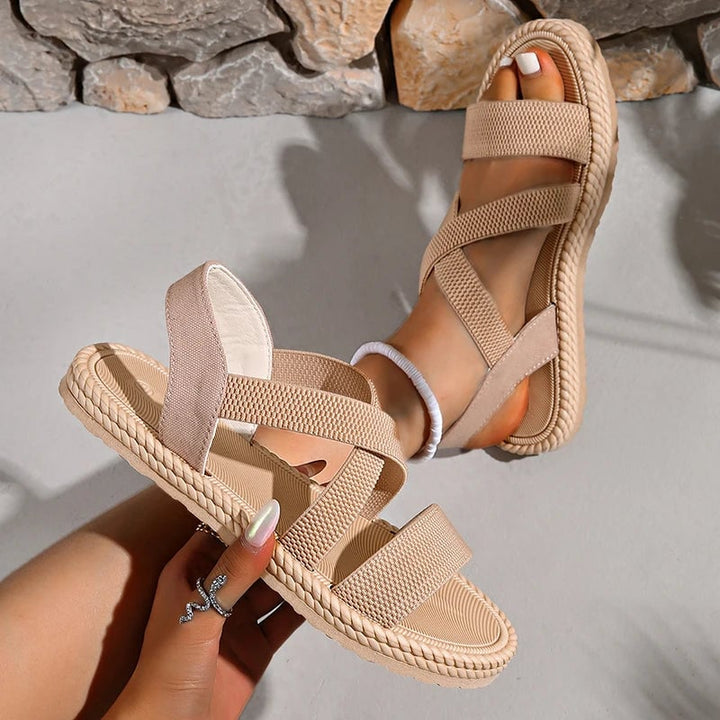 Top-down view of Adele woven sandals in beige showing strap layout
