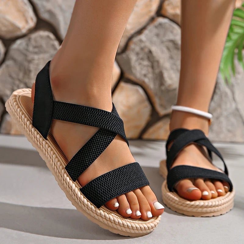 Side view of Adele sandals in black highlighting lightweight silhouette