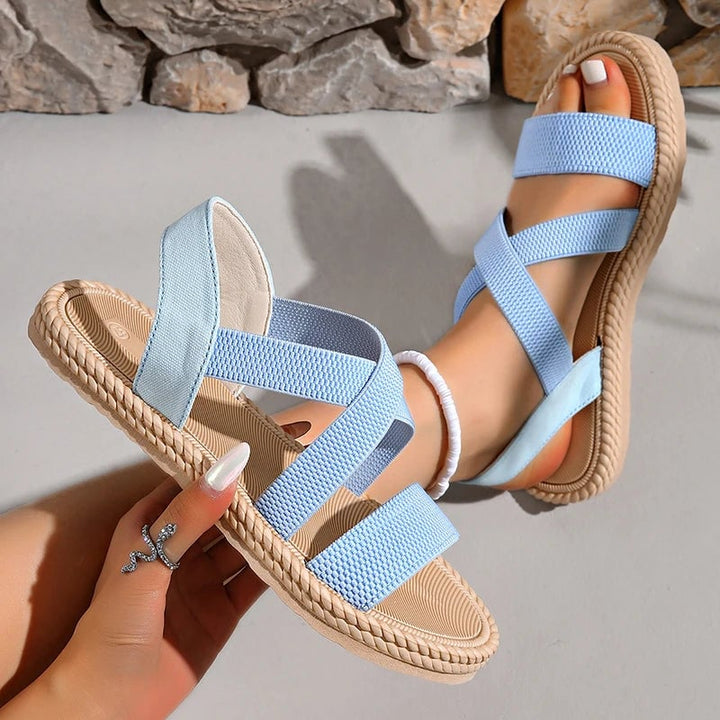 Side profile of Adele sandals in pink showing cushioned footbed