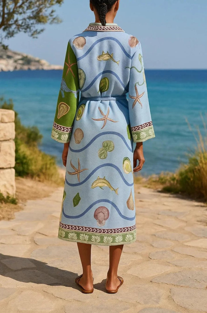 Full-length side view of the blue floral belted midi shirt dress showing the midi hemline