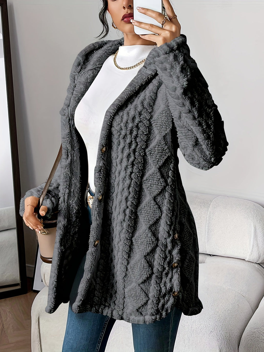 Woman wearing gray plush hooded cardigan paired with jeans for an effortless everyday style