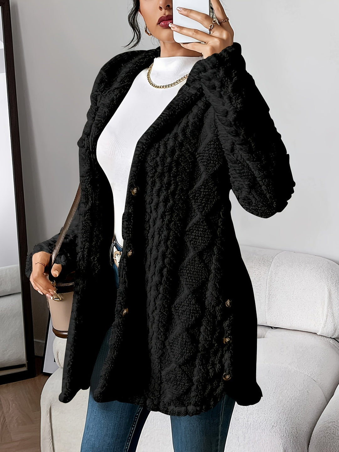 Flat lay of the Adriana hooded cardigan in black showing full length and open front design