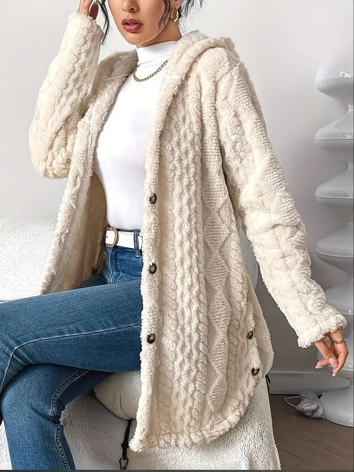 Full-length shot of a woman in the Adriana plush cardigan in black over a loungewear set