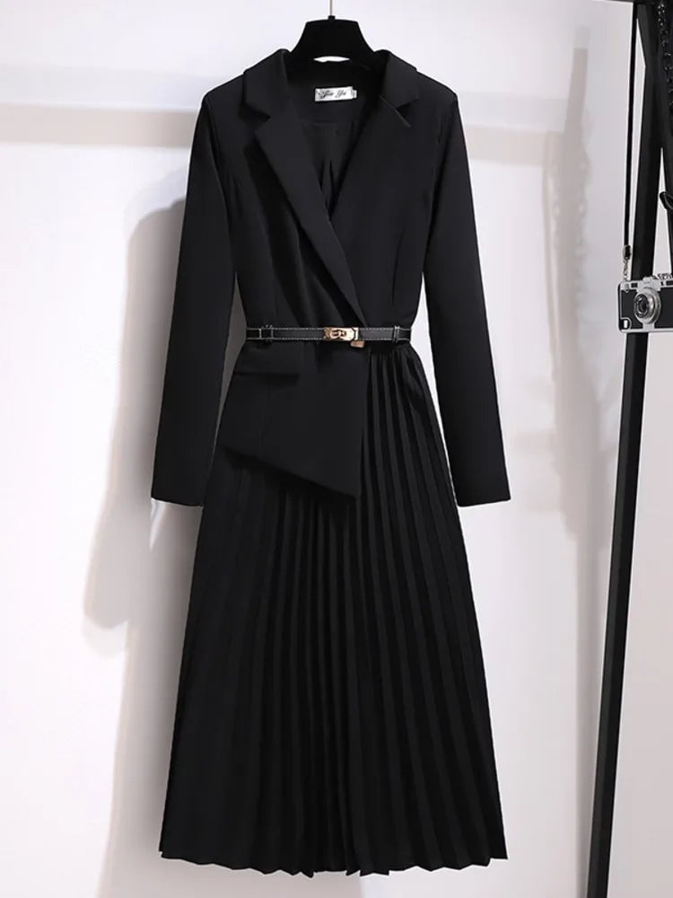 Full-length back view of the Adrienne belted pleated midi dress in black with long sleeves