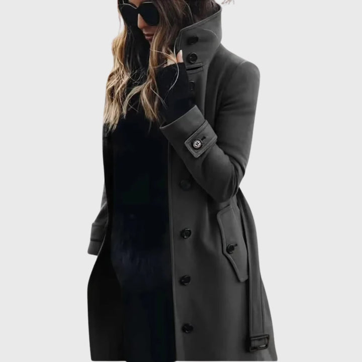 Detail flat-lay of the water-repellent long trench coat showing lapels, belt, and secure button closures