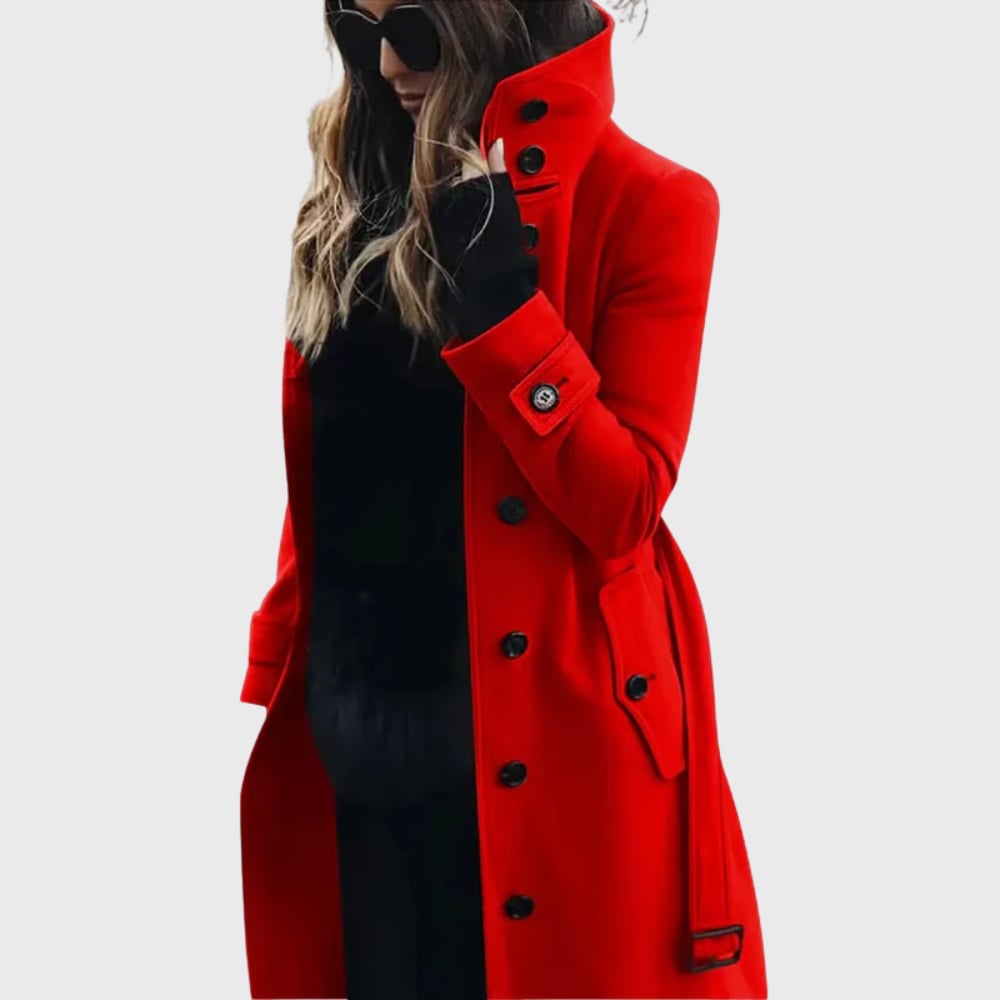 Model wearing the long trench coat in dark grey, styled over trousers for a polished everyday look