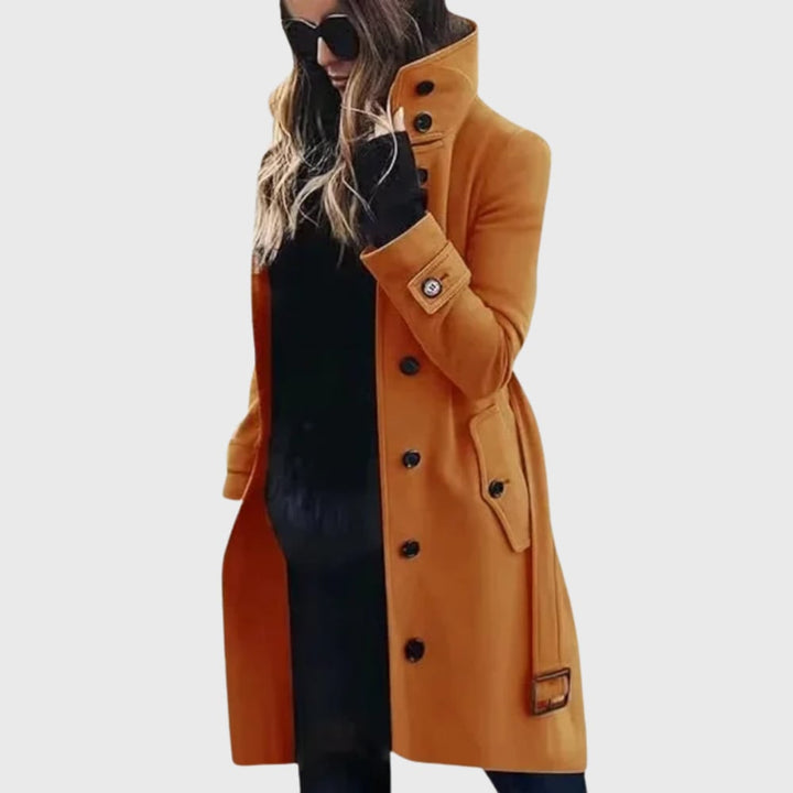 Overhead flat-lay of the trench coat in black showing lining, pockets, and button closure details