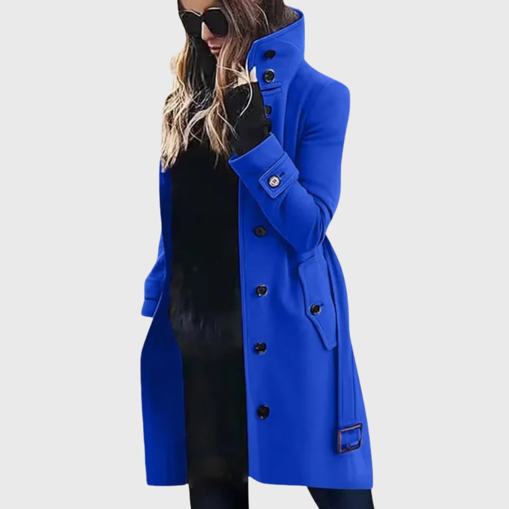Model in a water-repellent long trench coat in green, showcasing the elongating longline design