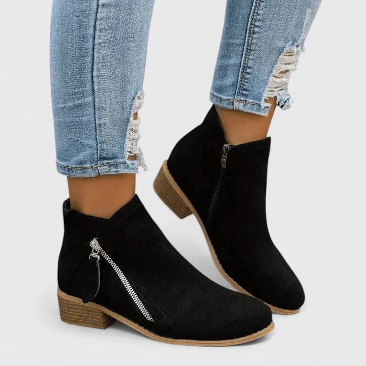 Side profile of the Ainsley orthopedic boot highlighting its durable construction and timeless design