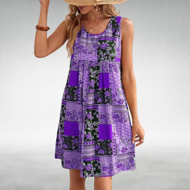 Model in the Ainsley boho beach dress in turquoise, styled with sandals for a casual summer look