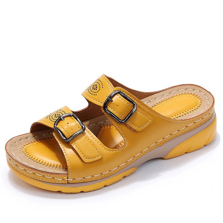Pair of Ainsley women's adjustable sandals in navy blue showing cushioned sole detail