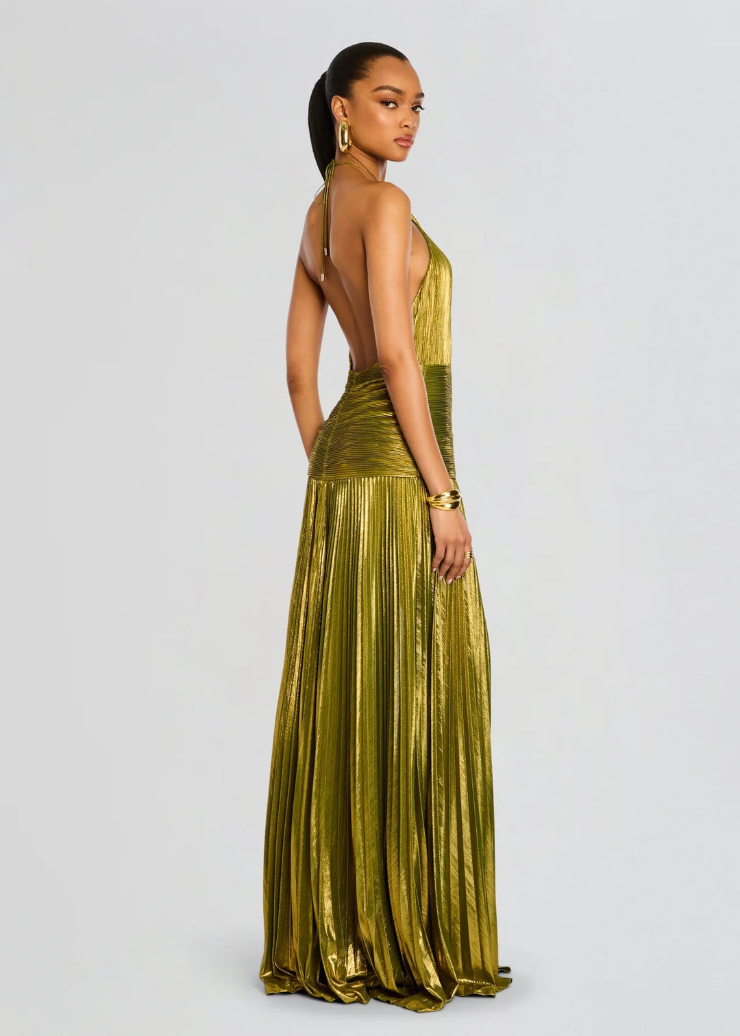 Close-up of the Alana long dress in metallic green highlighting its luxurious fabric finish