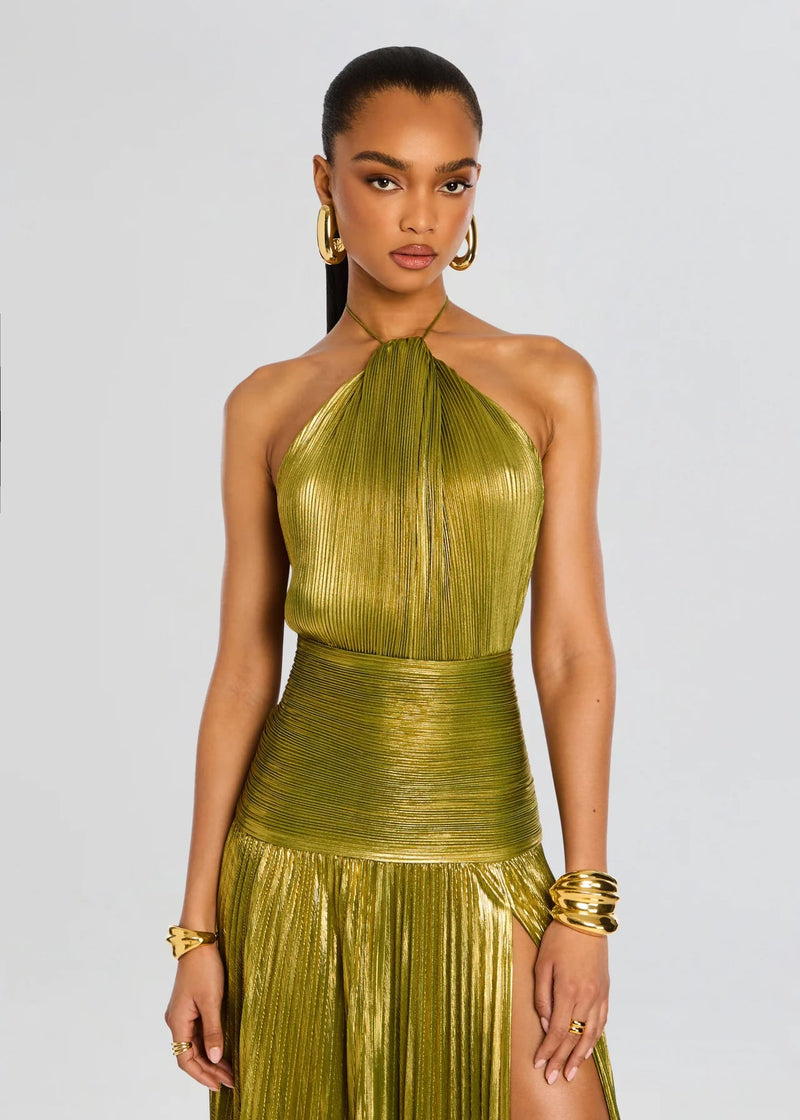 Model wearing the Alana green maxi dress at an evening event, full-length view