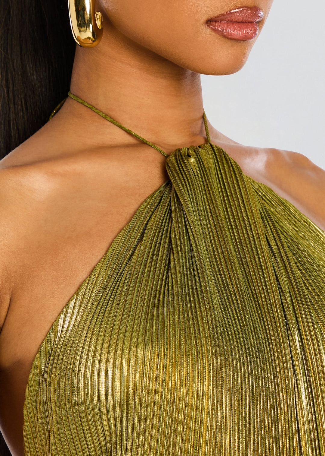 Back view of the Alana long green dress showcasing its graceful drape and clean lines