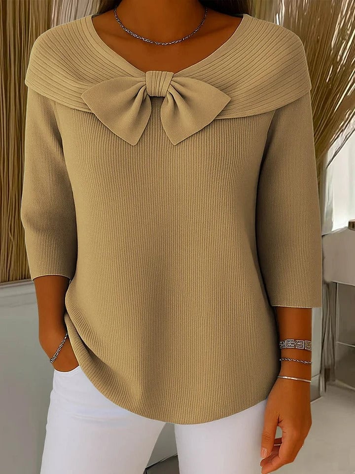 Close-up of the delicate bow detail on the Alana women's knit sweater