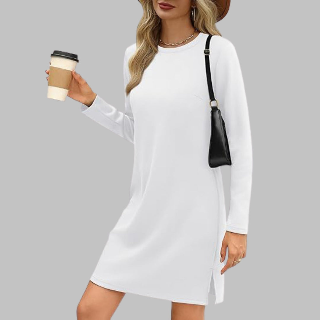 Woman wearing a white long sleeve round neck slim fit dress with a relaxed everyday look