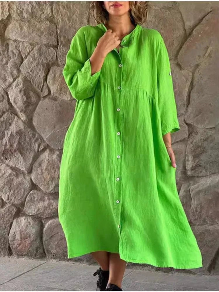 Front view of the Alba long sleeve linen shirt dress in white showing relaxed midi length
