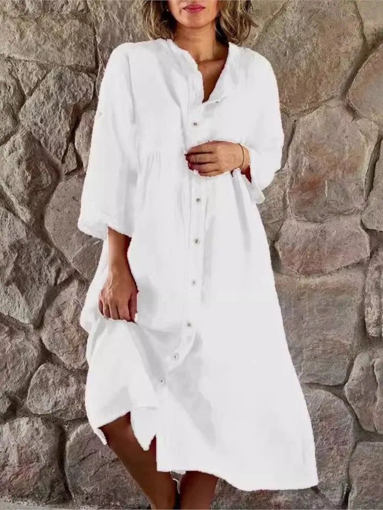 Side view of Alba linen shirt dress in green with sleeves casually rolled up at the cuffs