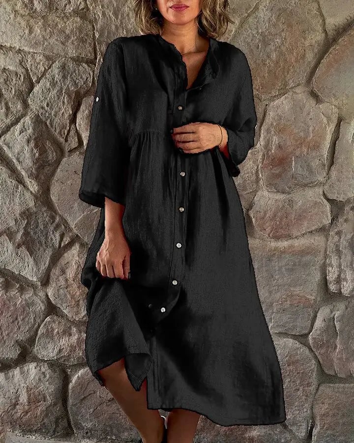 Woman styling the Alba linen midi dress belted at the waist in black with strappy sandals