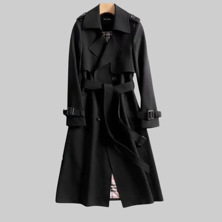Model wearing the Aleah classic trench coat styled over casual denim