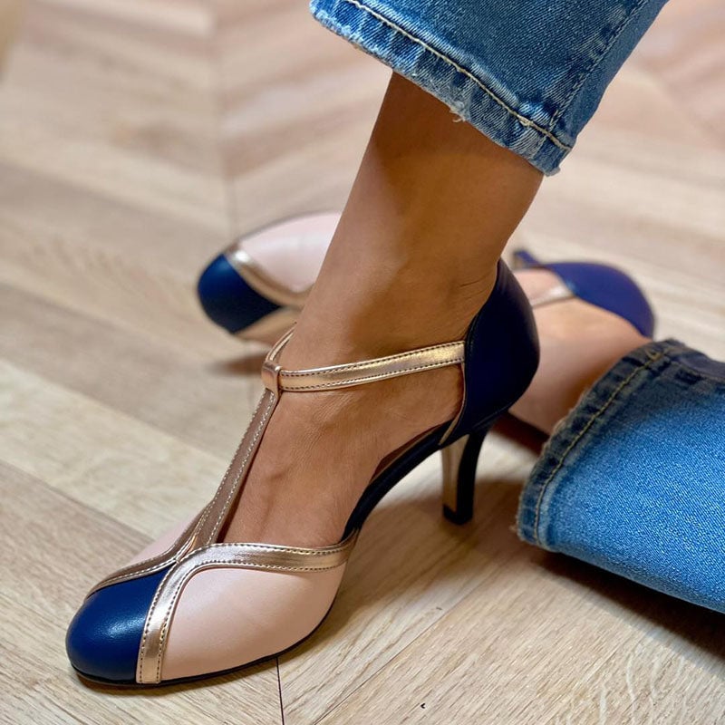 Alessia navy color-blocked T-strap pumps with round toe, front three-quarter view on white background