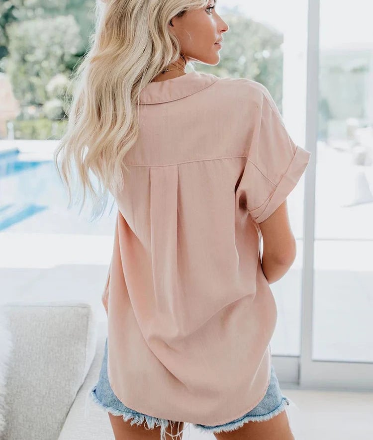 Close-up detail of the button-front and rolled-up sleeves on the Aletta casual blouse