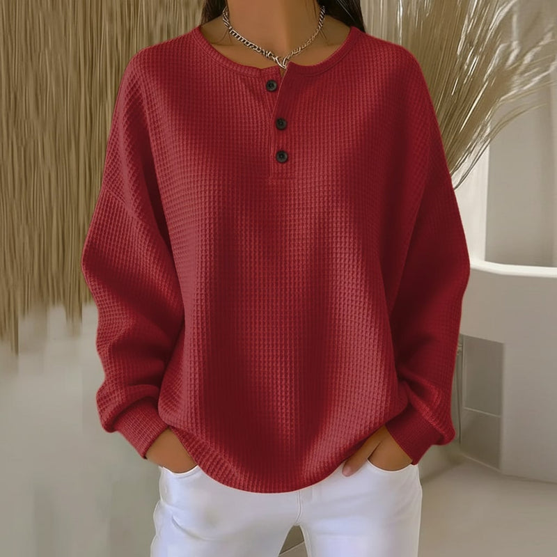 Close-up of the soft waffle knit fabric texture on the Alexa sweater