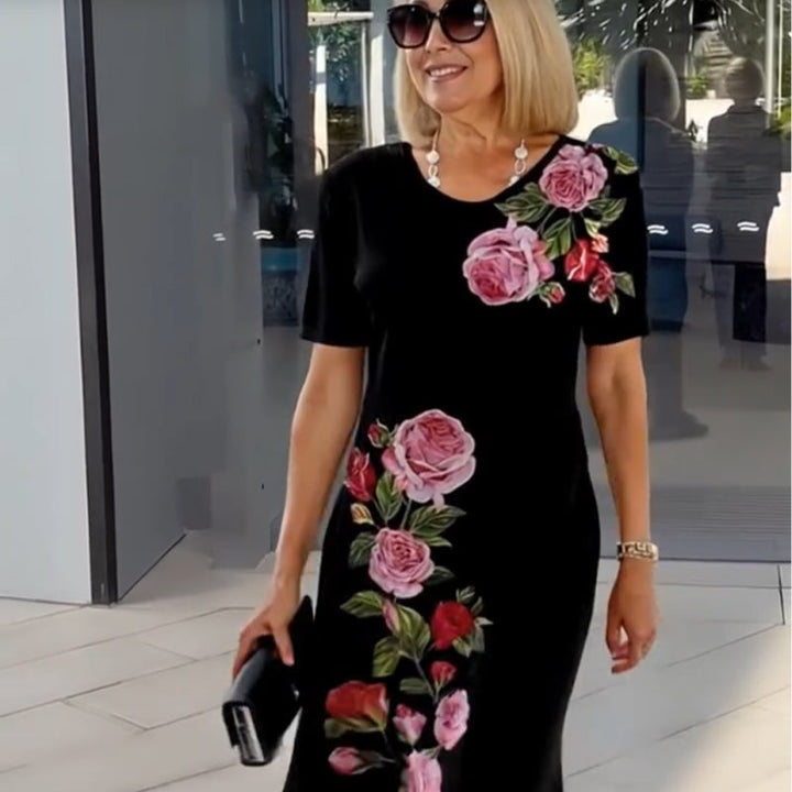 Detail shot of the waist area of a white floral A-line dress showing flattering fit