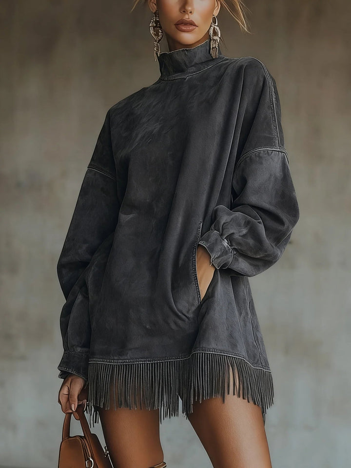 Model wearing brown faux suede oversized turtleneck dress with fringe detail, full-length view