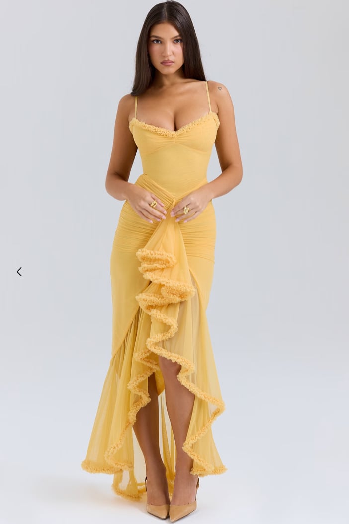 Alexandra ruched lace wedding guest dress in yellow with dovetail hem, front view