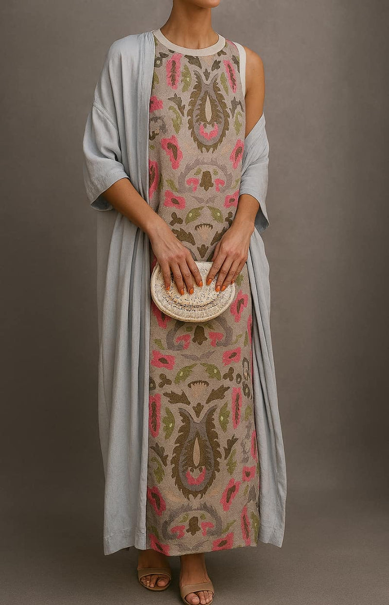 Model wearing the Alexia long dress and coat set from a side angle, showing full-length silhouette