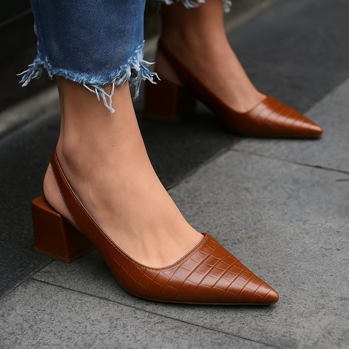 Close-up side view of Alexis orthopedic heels in brown showing heel height and lightweight construction