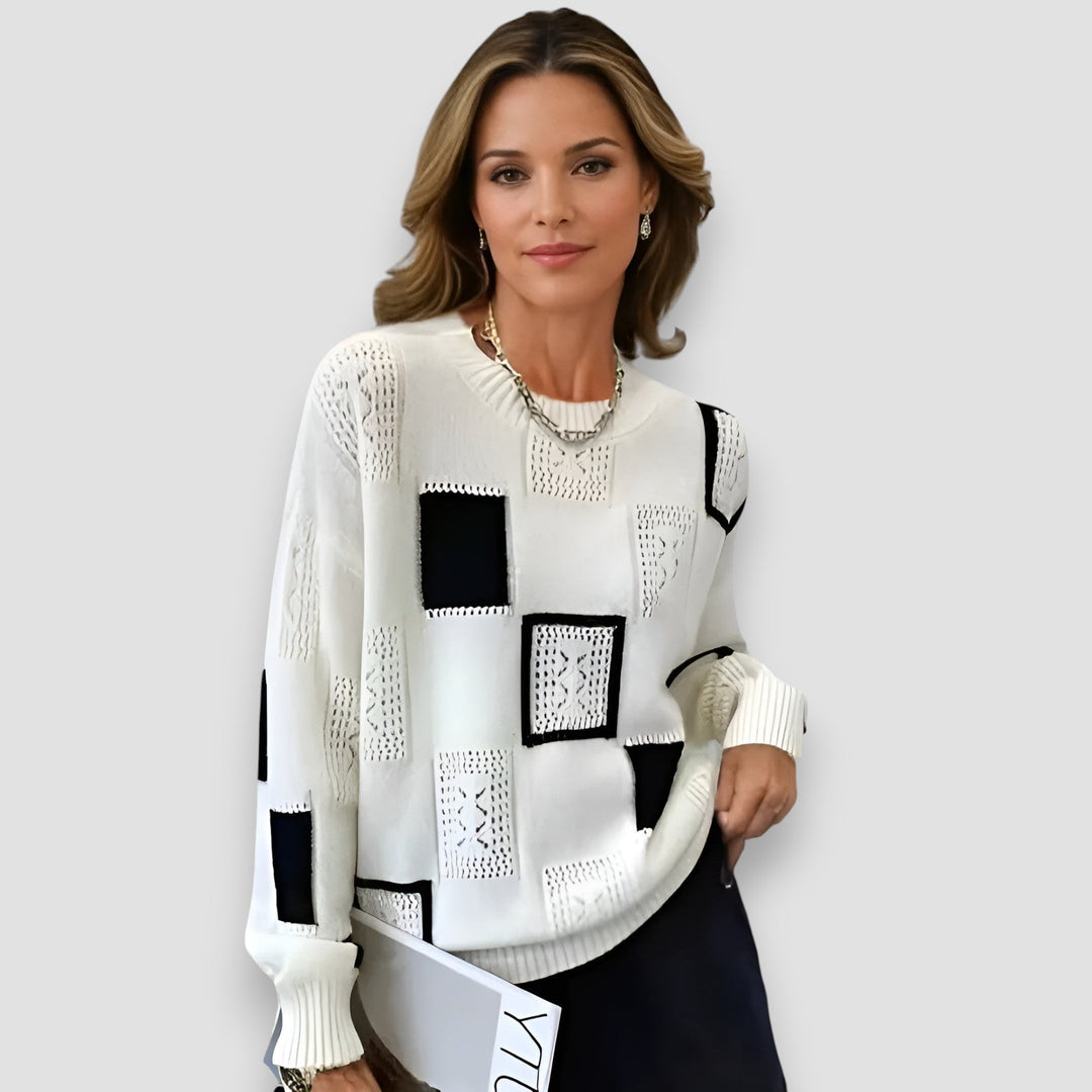 Model wearing the Elegant Squares Sweater in yellow, featuring a subtle square knit pattern and relaxed fit