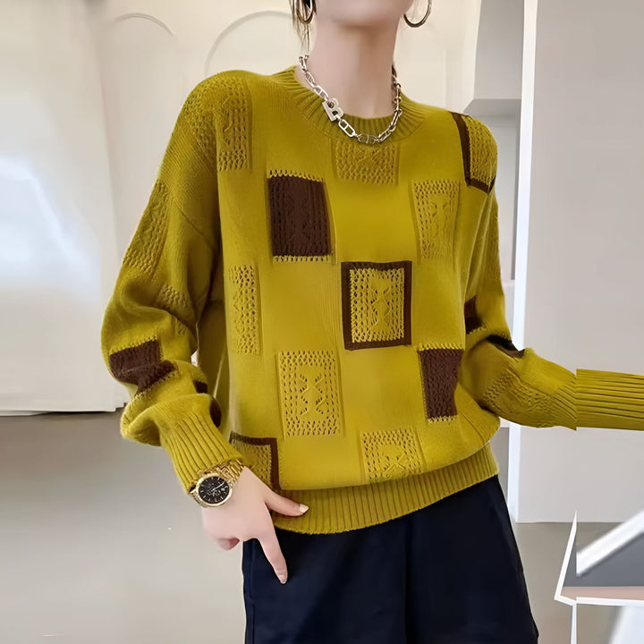 Model wearing the Elegant Squares Sweater in white styled with casual bottoms for an everyday polished look