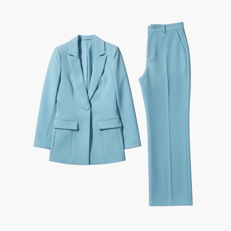 Woman wearing the Allegra light blue blazer suit set with structured lapel jacket and high-waisted straight-leg pants