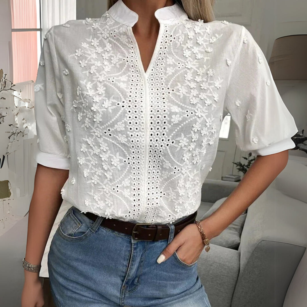 White lace embroidered blouse with mandarin collar, front view on model