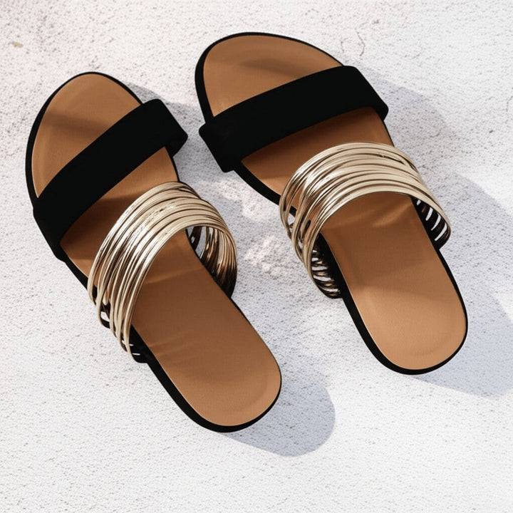 Flat lay of all five Alma sandal color options: Onyx Black, Cream White, Chestnut Brown, Khaki, and Pink