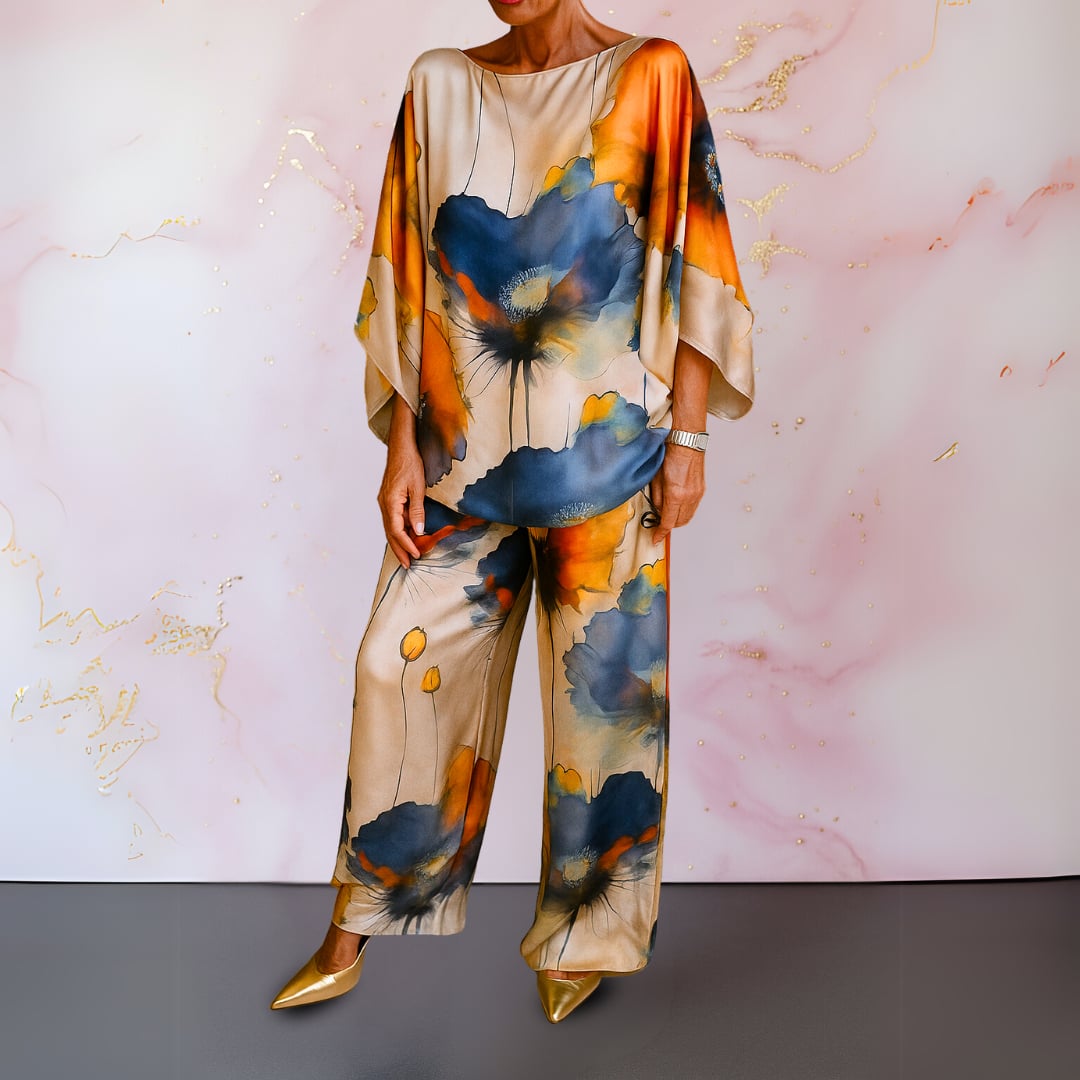 Woman wearing a navy blue satin two-piece set with a coordinated top and wide-leg pants