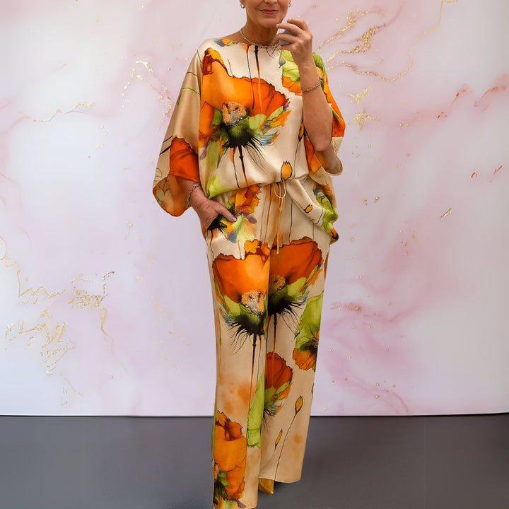 Side view of the Alma-Rose satin two-piece set in mandarin cream highlighting the relaxed pant fit