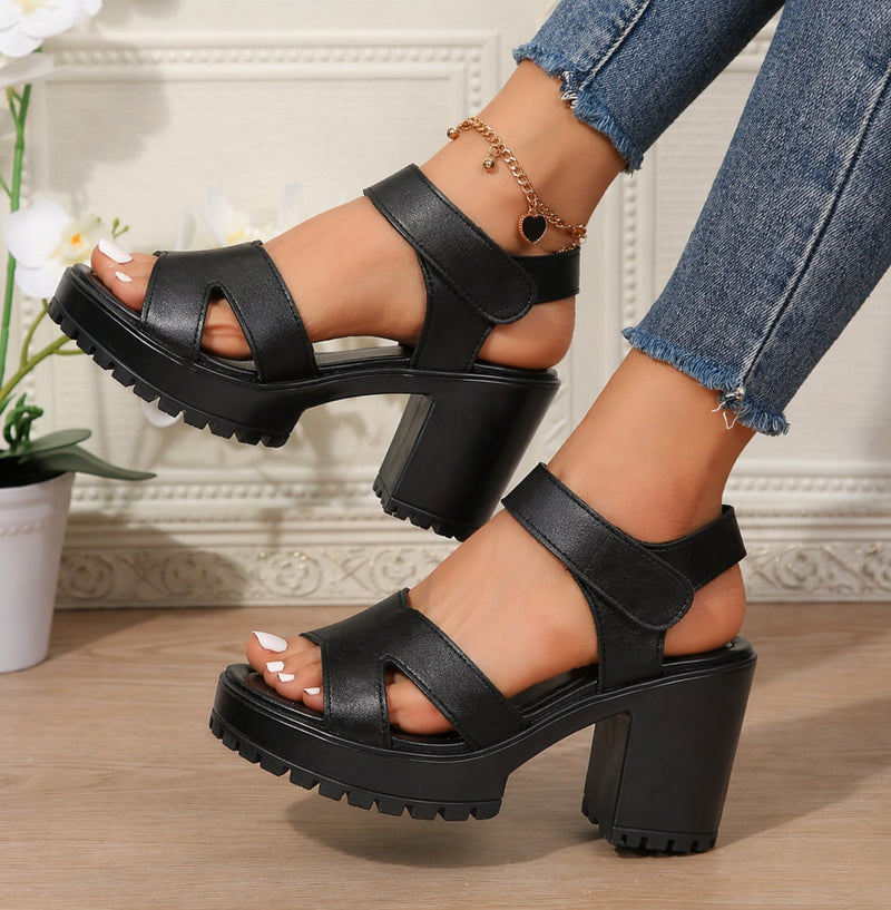 Alma black sandal side profile showing structured strap detail and padded footbed